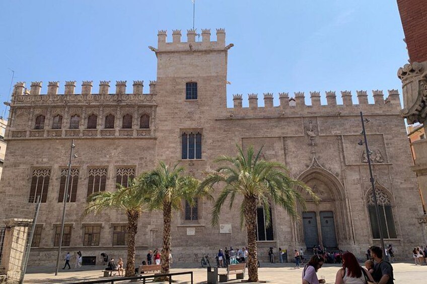 A historic building with a tower and arched windows. 3