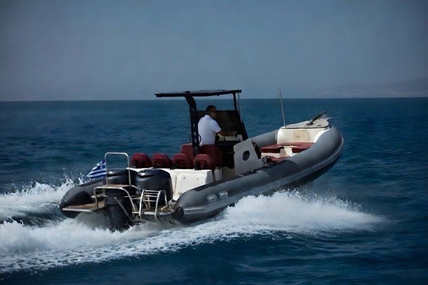 A motorboat with a man steering, moving through a body of water. 3