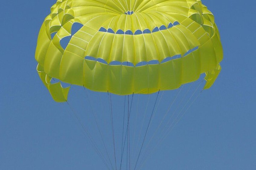 A yellow parachute against a clear blue sky. 2