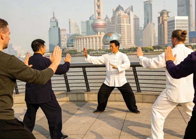 A group practicing Tai Chi on a waterfront promenade with a city skyline in the background. 3