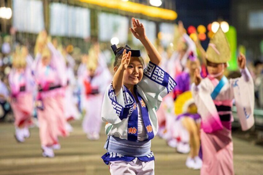 A person in traditional attire performing a dance. 5