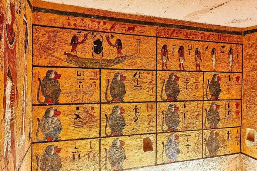 A wall with ancient Egyptian hieroglyphs and figures. 3