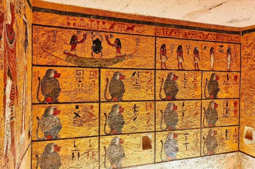 A wall with ancient Egyptian hieroglyphs and figures. 3