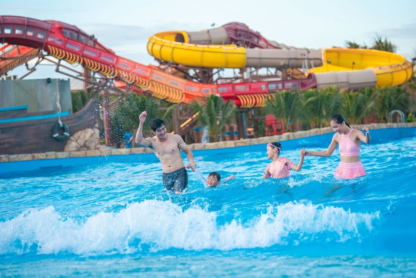 A water park with a pool and water slides in the background. 5