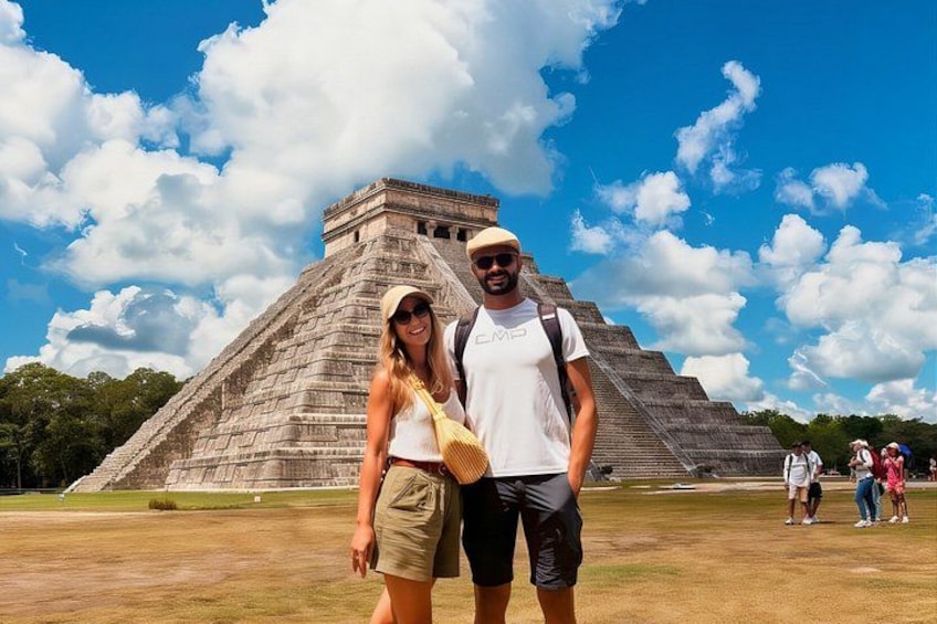 A large pyramid structure with tourists in the foreground. 1