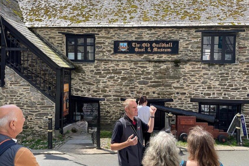 A stone building with a sign reading 'The Old Guildhall Gaol & Museum.' 3