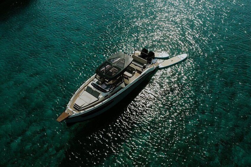 A boat on clear turquoise water. 1