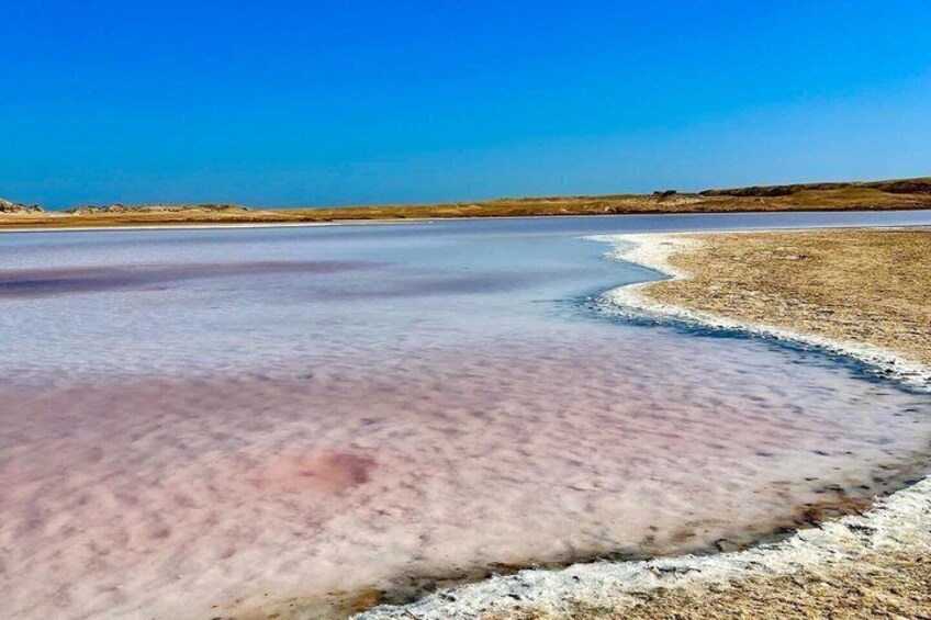 A salt flat with a clear sky. 5