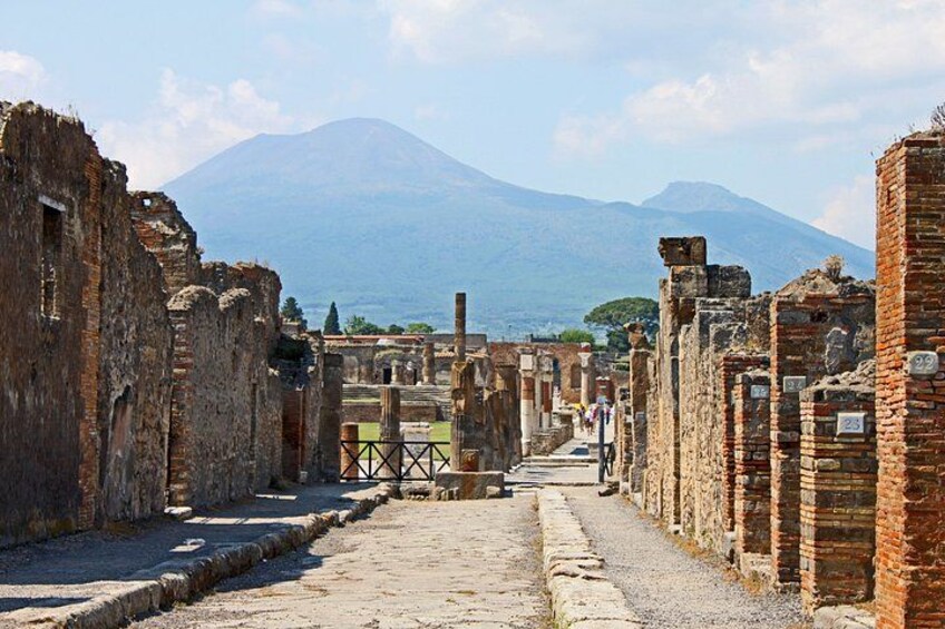 Ancient ruins with a mountain in the background. 2