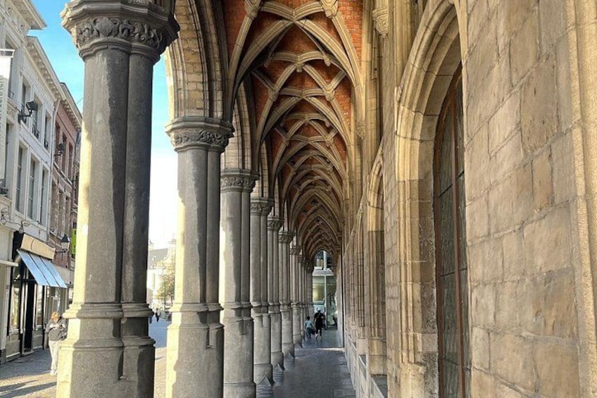 A cathedral with a long nave, stone columns, and pointed arches. 3