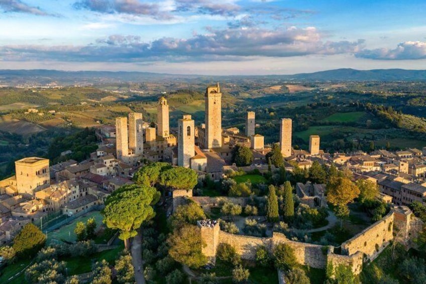 A historic town with medieval architecture, including towers and fortified walls. 5