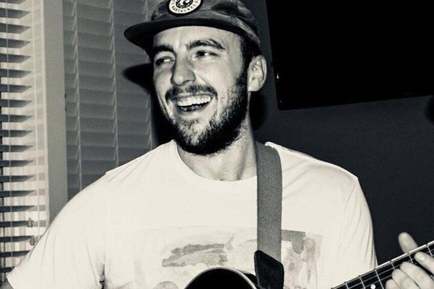 A person playing a guitar. 4