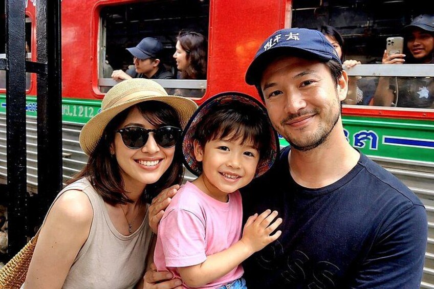 A family of three on a train. 1