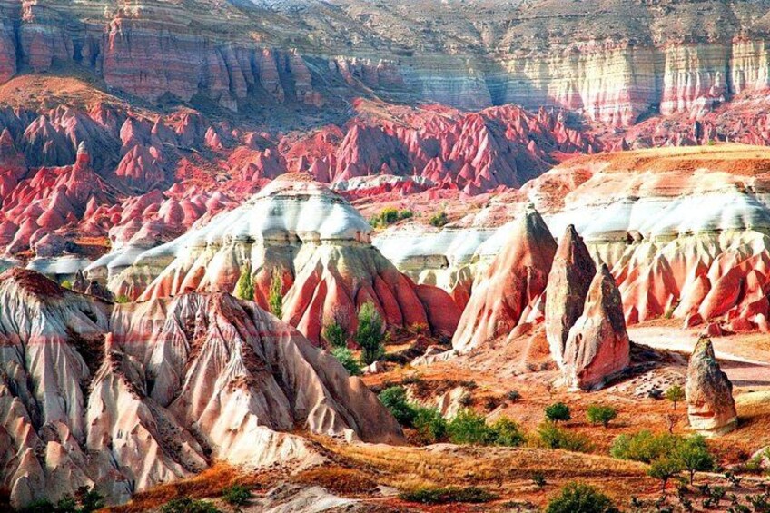 A landscape with colorful rock formations and a clear sky. 5
