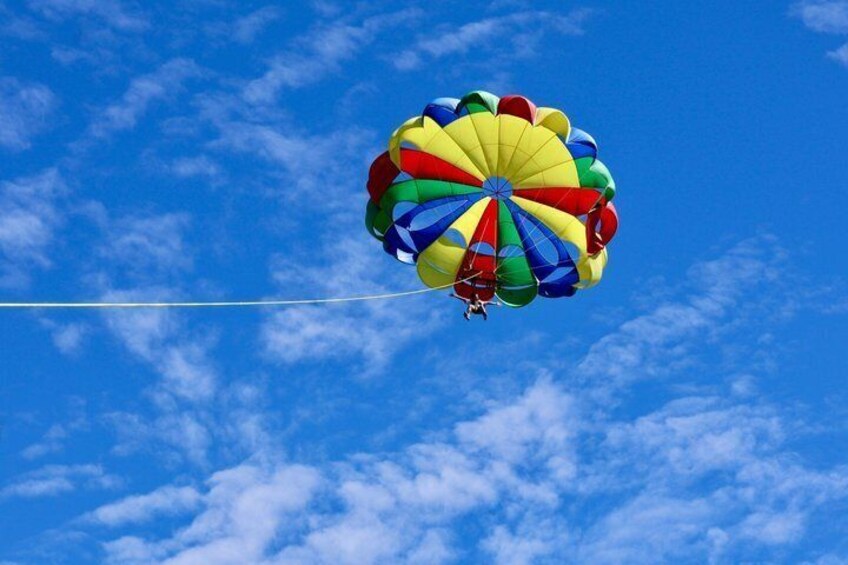 A colorful parachute with a clear sky in the background. 5