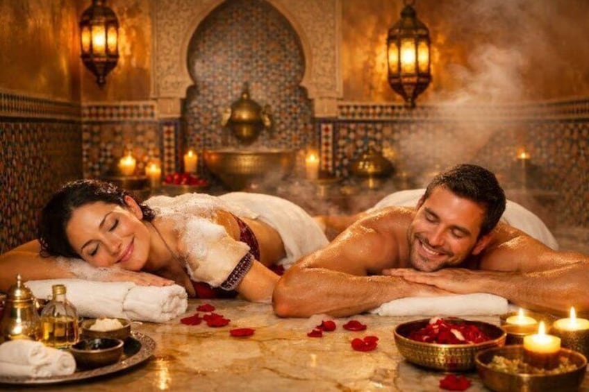 A couple receiving a traditional spa treatment in a Moroccan setting with ornate decor and candles. 1