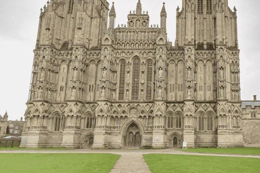 A large Gothic cathedral with intricate stonework and a central entrance. 2