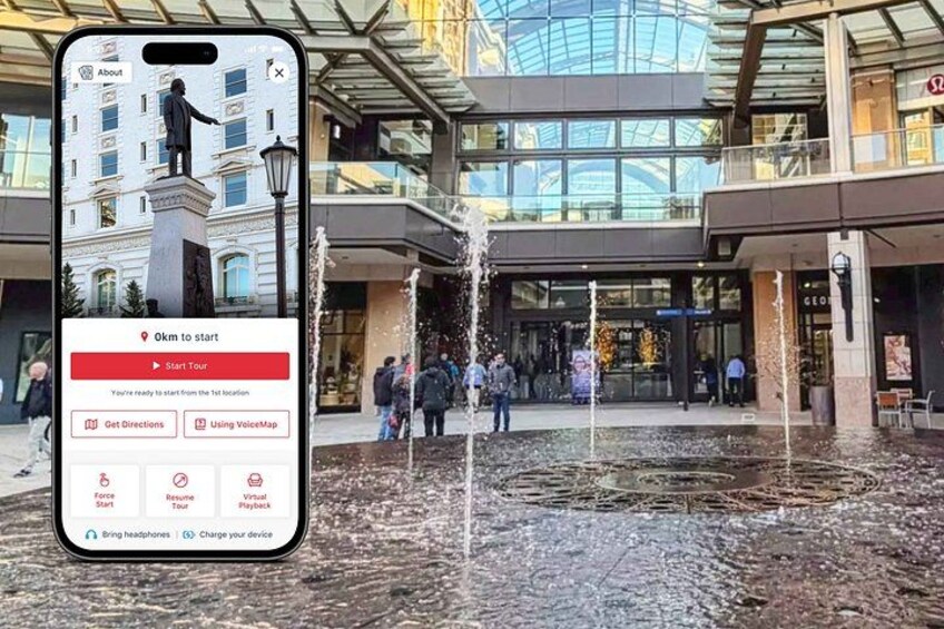 A smartphone displaying a tour app interface with a statue and fountain in the background. 1
