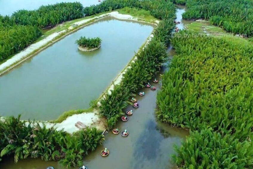 A waterway with boats and dense vegetation. 1