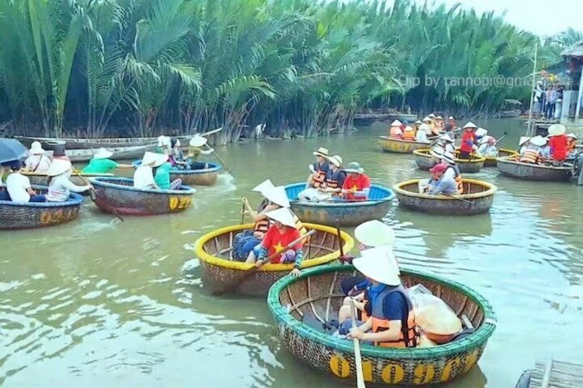 People in small boats on a river surrounded by dense greenery. 2