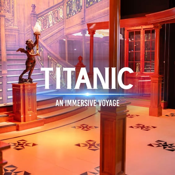 A grand interior with ornate columns, a statue, and a large illuminated sign reading 'TITANIC AN IMMERSIVE VOYAGE.' 3