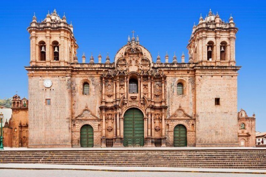 A historic cathedral with twin bell towers and a central dome. 2