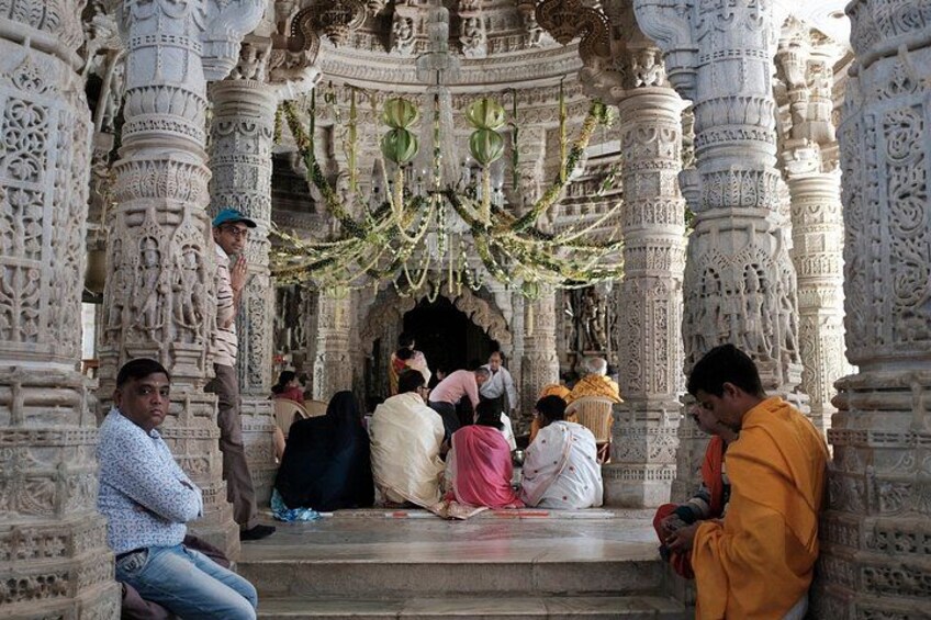 A temple with intricate carvings and a central shrine. 5
