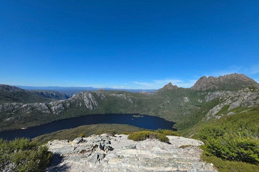 A mountainous landscape with a lake and rocky terrain. 3