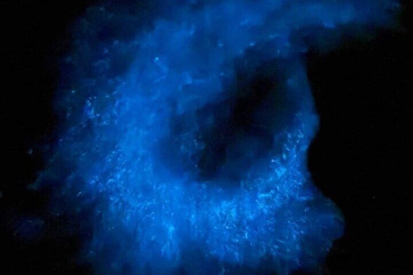A dark background with a blue light source creating a glowing effect. 3