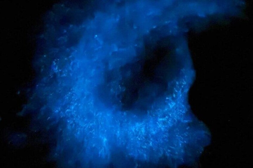 A dark background with a blue light source creating a glowing effect. 5