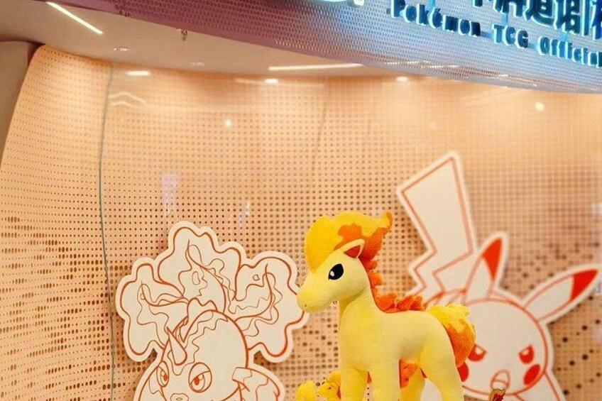 A toy pony on a perforated surface with a Pokemon-themed design. 5