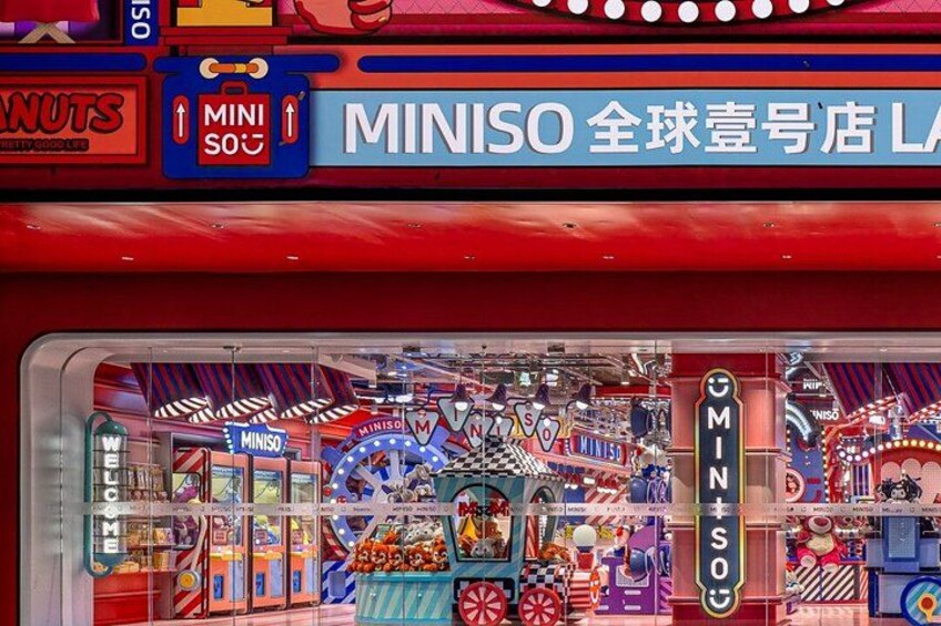 A brightly lit storefront with colorful signage and a variety of products on display. 3