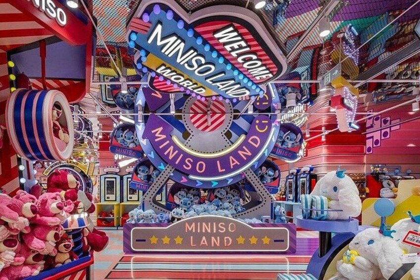 A colorful arcade with a large 'Miniso Land' sign, plush toys, and various arcade machines. 4
