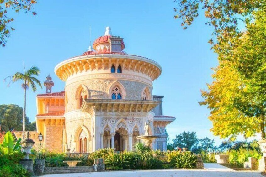 A historic building with a round tower, ornate arches, and a dome. 3