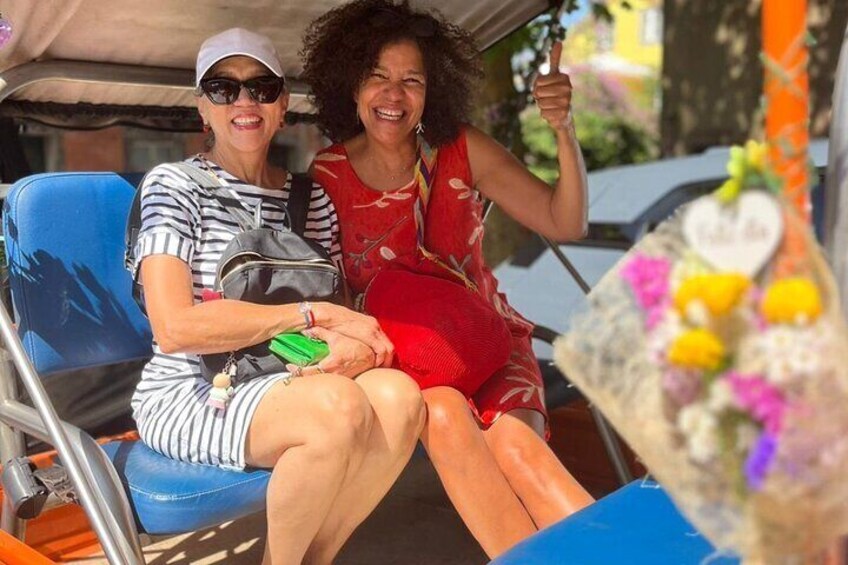 Two people on a boat with a bouquet of flowers. 1