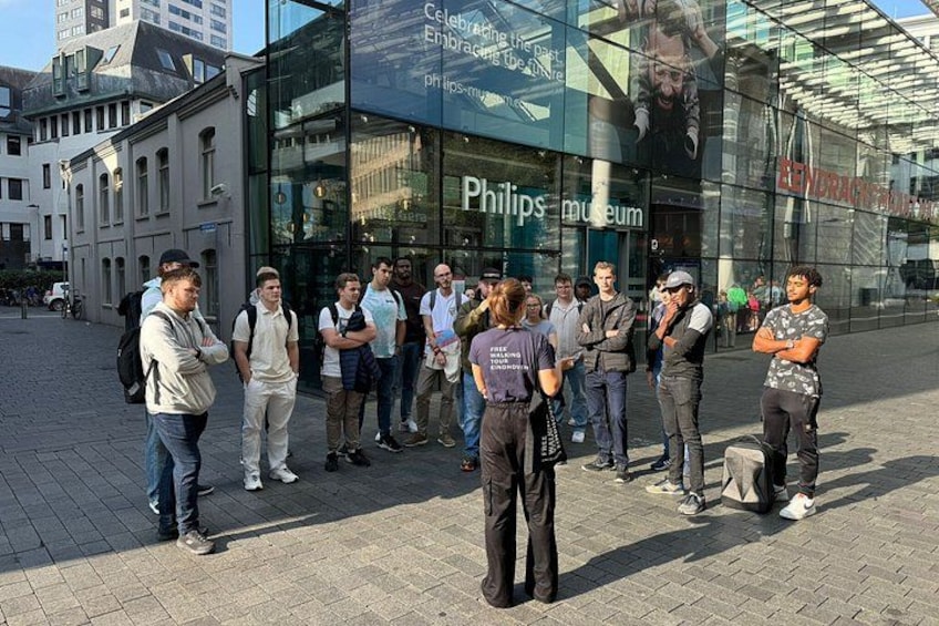 A group of people standing in front of the Philips Museum. 1