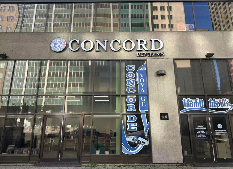 A building with a large sign reading 'CONCORD DEPUIS 1995' and a bus service advertisement. 3