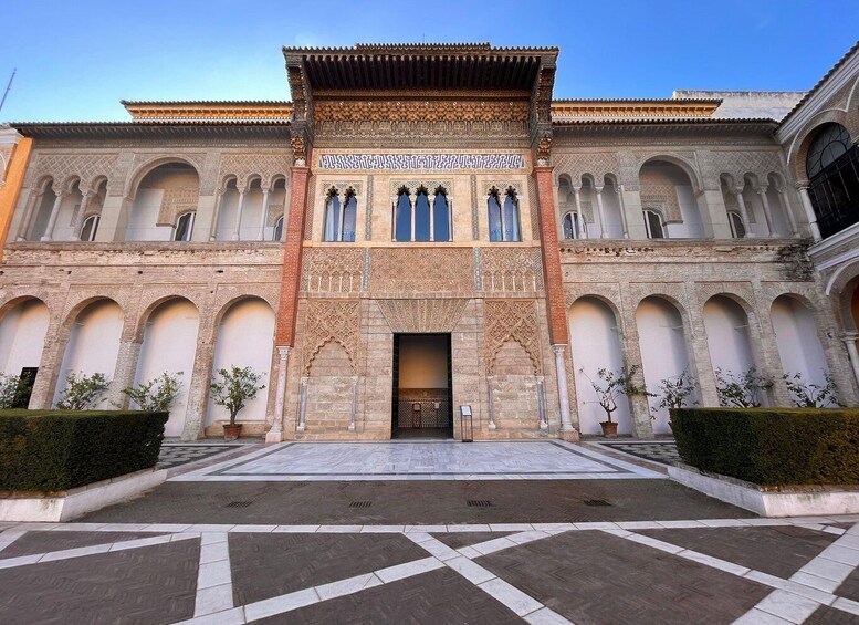 A historic building with intricate arches and detailed facade. 1