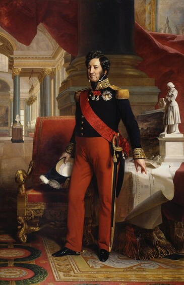 A man in a military uniform with medals, standing in an ornate room with a red carpet, a large chair, and a statue in the background. 4