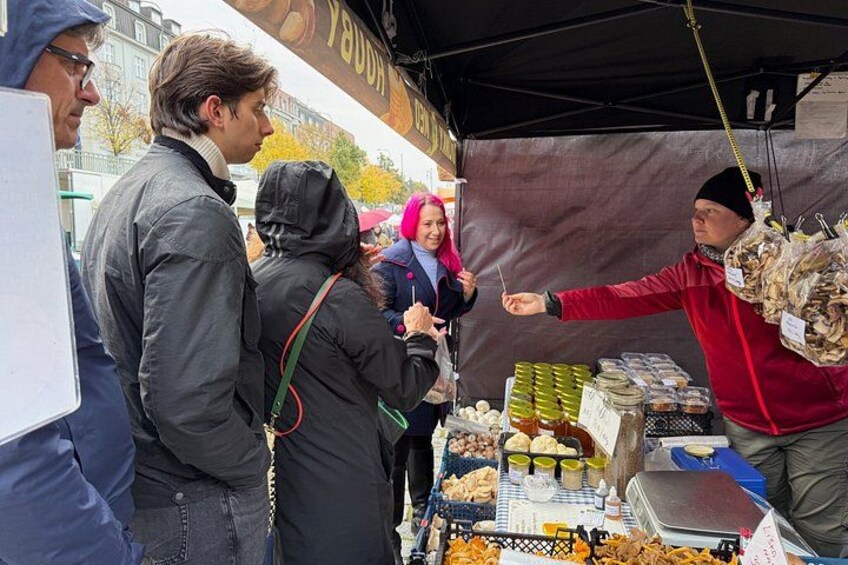 A street food vendor selling food at a market. 3