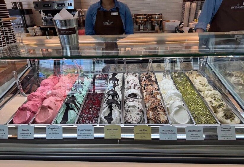 A display case of assorted ice cream flavors in a cafe. 2