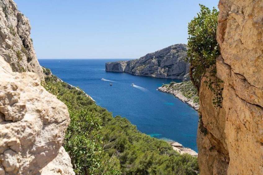 A coastal cliff with a view of the sea and a rocky outcrop. 2