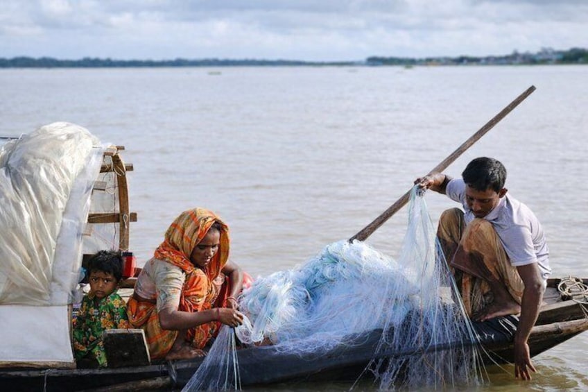 People on a boat with fishing nets. 1