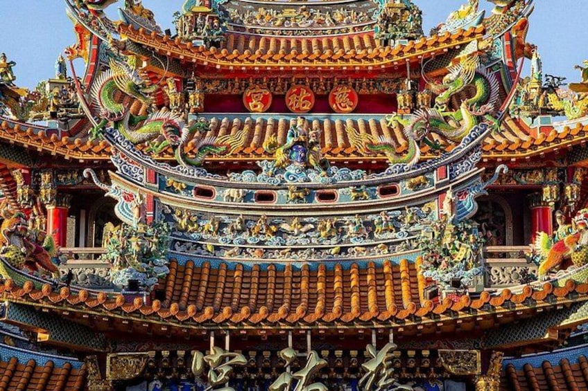 A traditional Chinese temple with ornate architecture, detailed carvings, and colorful decorations. 4