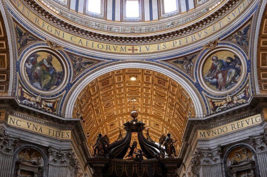 An ornate interior with a golden dome ceiling, intricate frescoes, and classical statues. 3