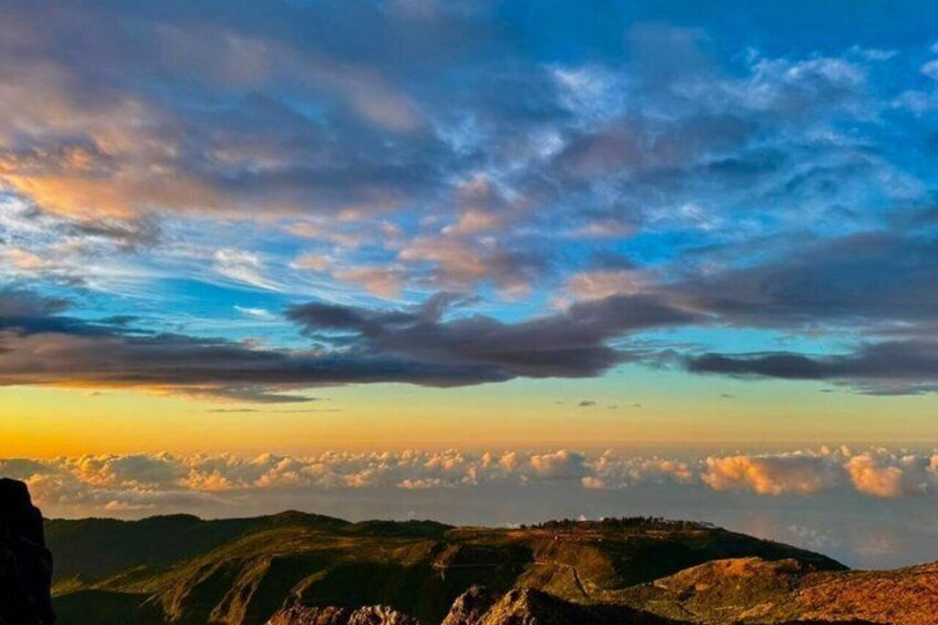 A mountainous landscape with a clear sky and clouds. 3