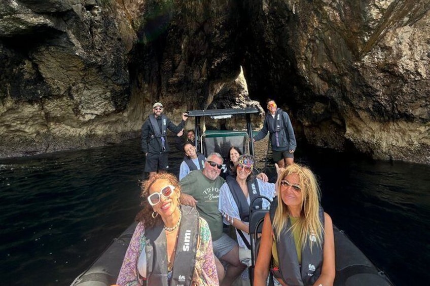 A group of people on a boat in a cave. 2