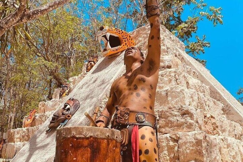 A person climbing a pyramid with a leopard head helmet. 3