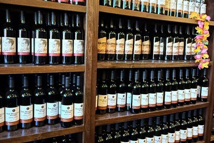 A wine rack with multiple bottles of wine, each with a label. 5
