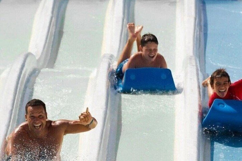 People sliding down water slides. 2